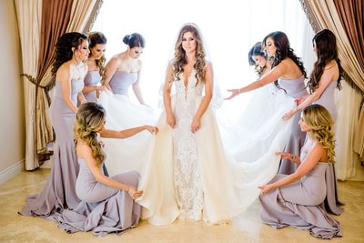 Bride posing with bridesmaids