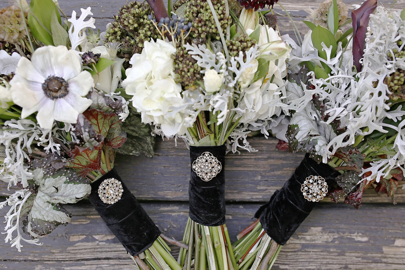 black  and gold wedding bouquets with crystal brooch