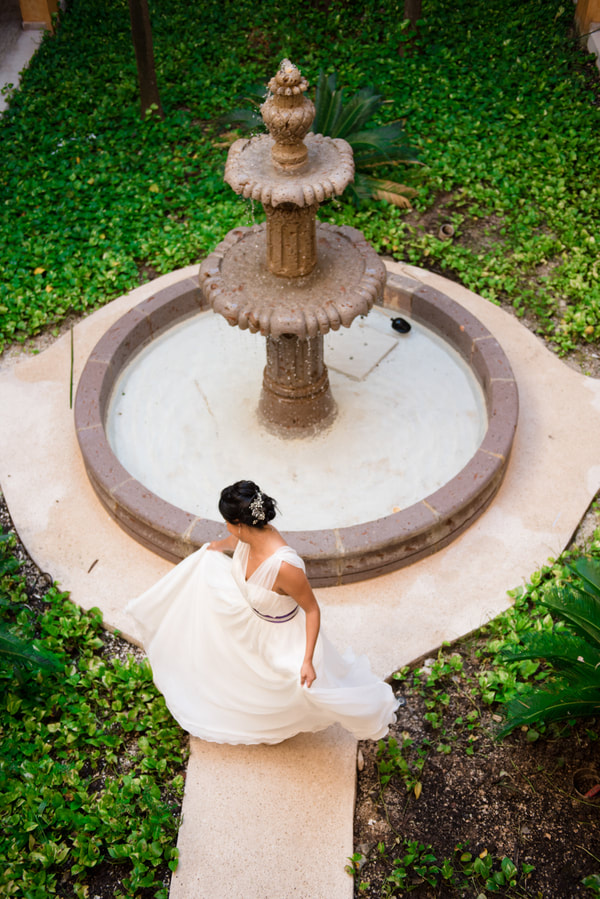 Bride by a fountain