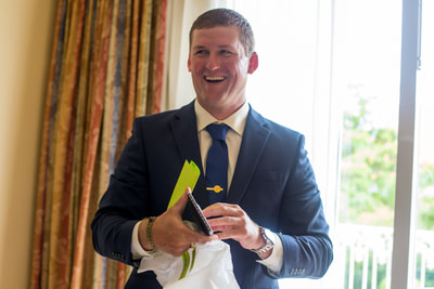 Happy groom with a present