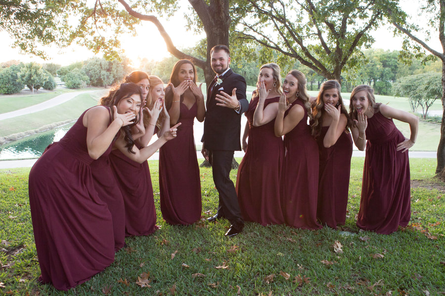 Bride and groom with bridal party goofy photo